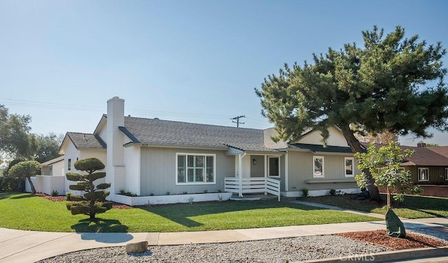 ranch-style house featuring a front lawn