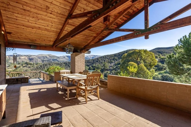 view of patio featuring a mountain view and a gazebo