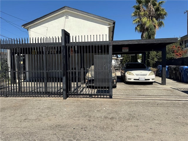 view of gate with a carport