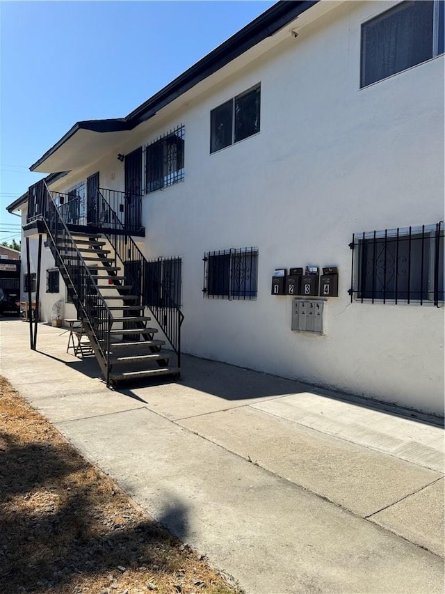 view of property exterior with a patio area