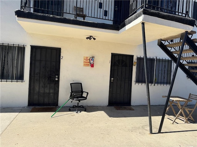 doorway to property with a patio area