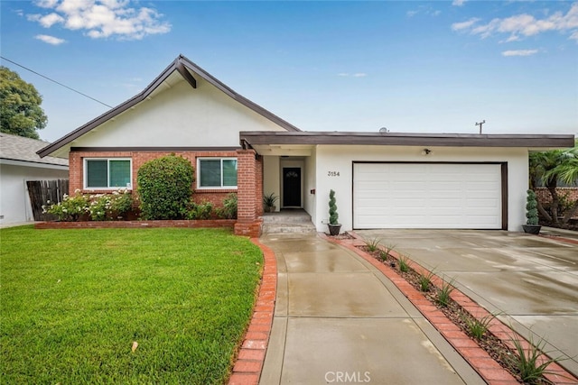 single story home with a front yard and a garage