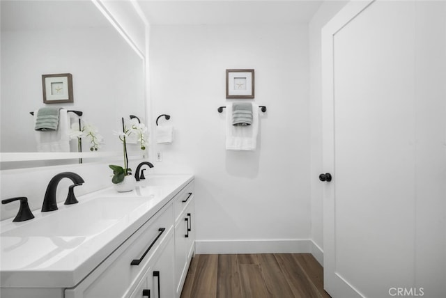 bathroom with vanity and hardwood / wood-style flooring