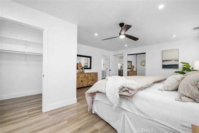 bedroom with ceiling fan and light hardwood / wood-style flooring