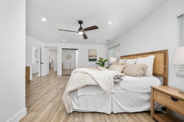 bedroom with ceiling fan and light wood-type flooring