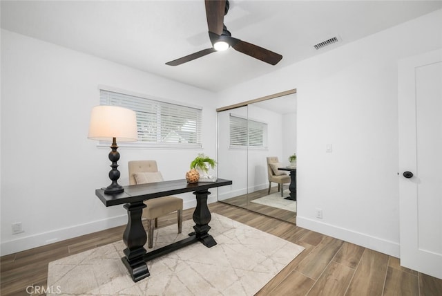 interior space with ceiling fan and hardwood / wood-style flooring