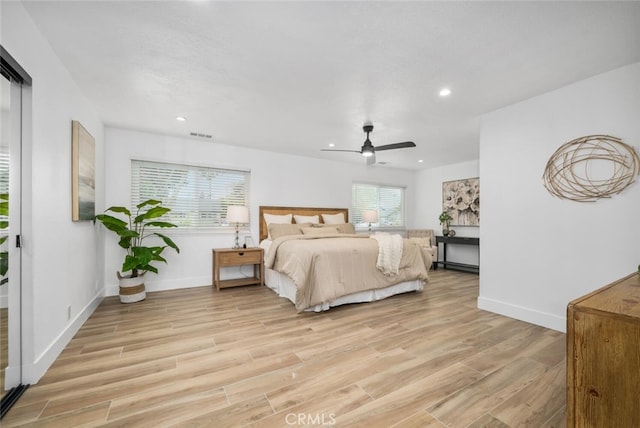 bedroom featuring light hardwood / wood-style flooring and ceiling fan