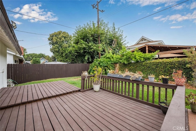 wooden deck with a yard