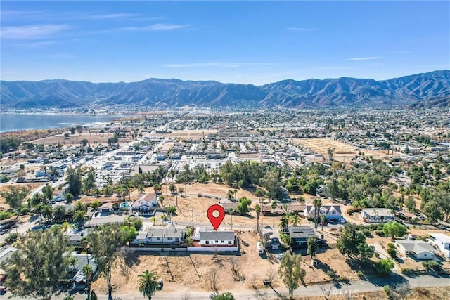 bird's eye view with a water and mountain view