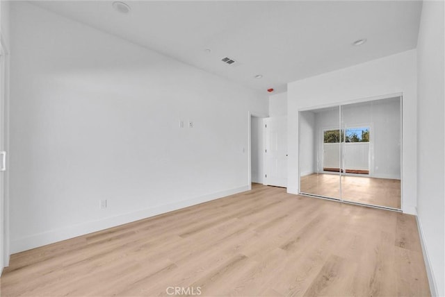 empty room with light wood-type flooring