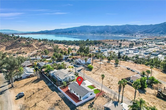 aerial view featuring a water and mountain view