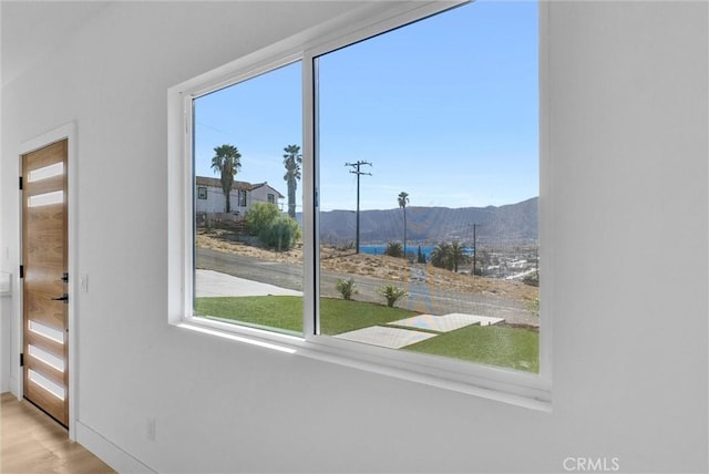 entryway with wood finished floors and a mountain view