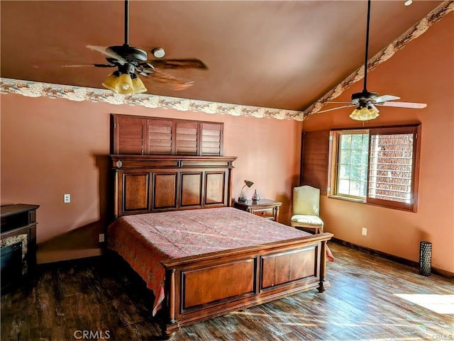 bedroom with ceiling fan, lofted ceiling, and dark wood-type flooring