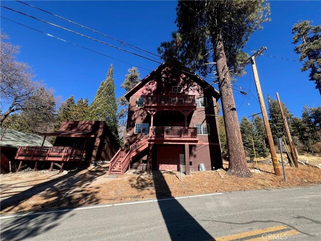 view of front of home with a wooden deck