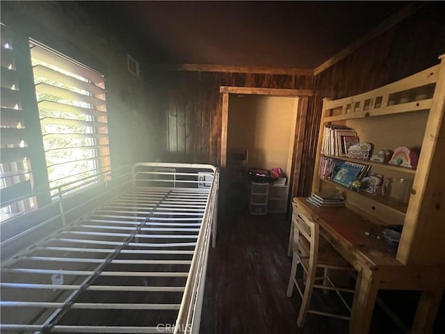 bedroom with wooden walls