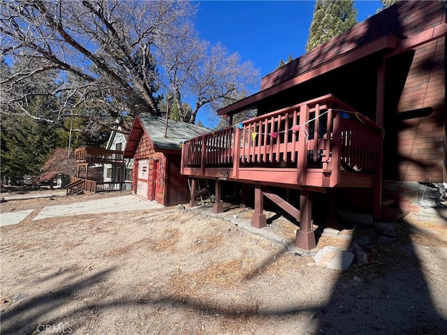 view of property exterior with a deck