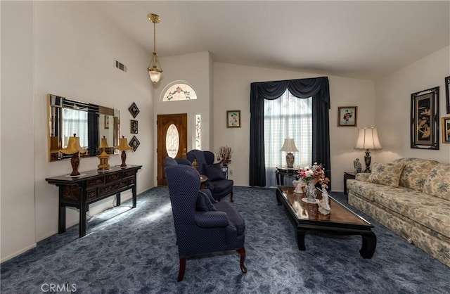 living room featuring visible vents, high vaulted ceiling, and carpet