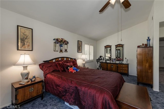 carpeted bedroom featuring a ceiling fan and vaulted ceiling