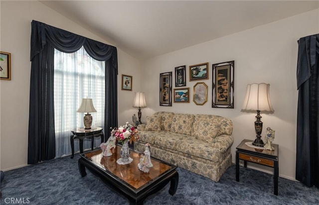 living room featuring carpet and vaulted ceiling