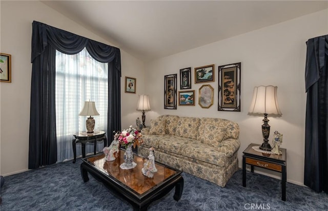 carpeted living area featuring lofted ceiling