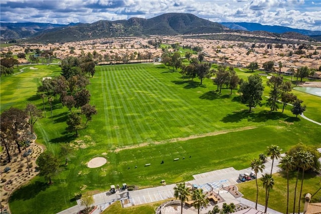 birds eye view of property featuring a mountain view