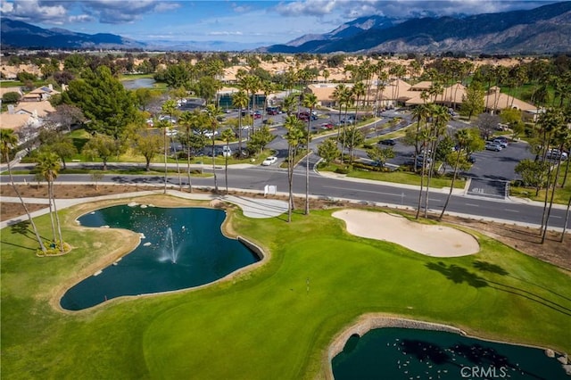 exterior space with a mountain view and view of golf course