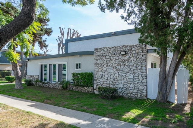 view of property exterior featuring a yard