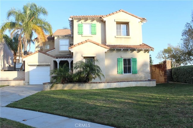 mediterranean / spanish house with a garage and a front lawn