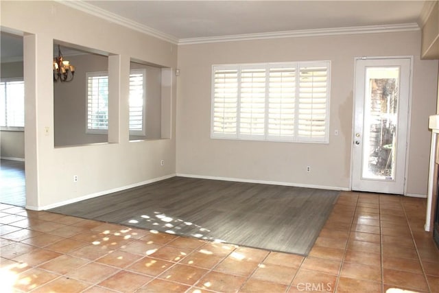 unfurnished room with a chandelier, tile patterned floors, and crown molding