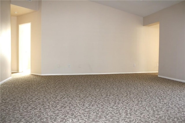 unfurnished room featuring carpet