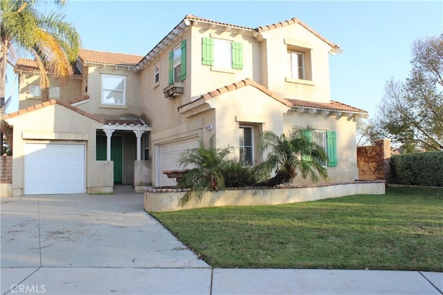 mediterranean / spanish house featuring a garage and a front lawn