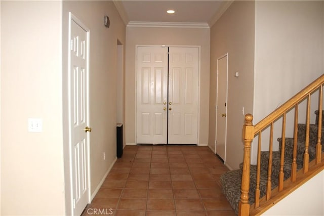 hall featuring crown molding and dark tile patterned flooring