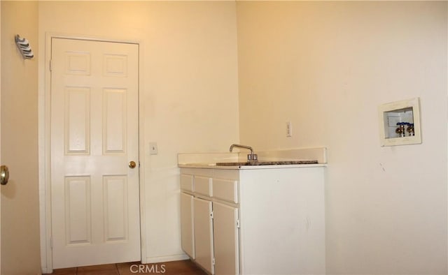 laundry room featuring cabinets and washer hookup