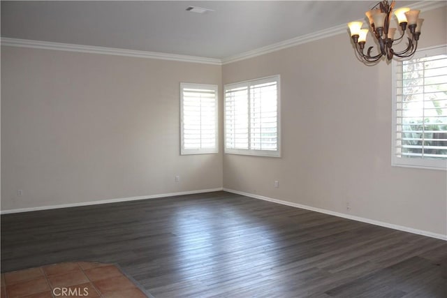 unfurnished room featuring dark hardwood / wood-style flooring, ornamental molding, and a notable chandelier