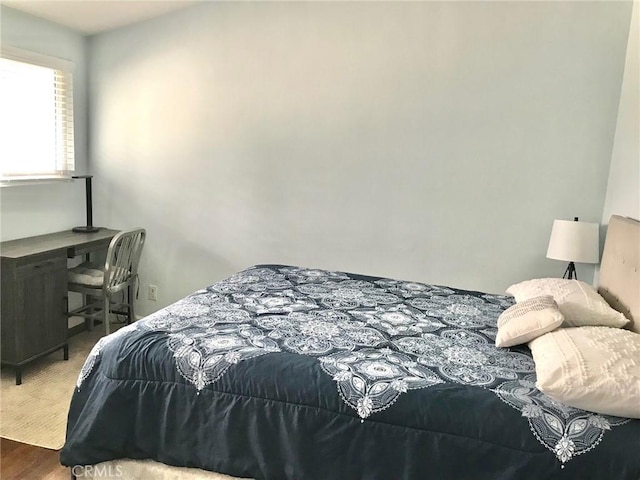 bedroom featuring wood-type flooring