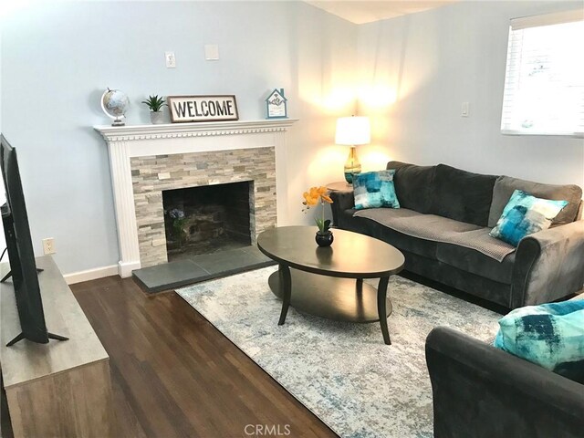 1729 Craigton Ave, Hacienda Heights, CA 91745 - living room with a tile fireplace, baseboards, and wood finished floors