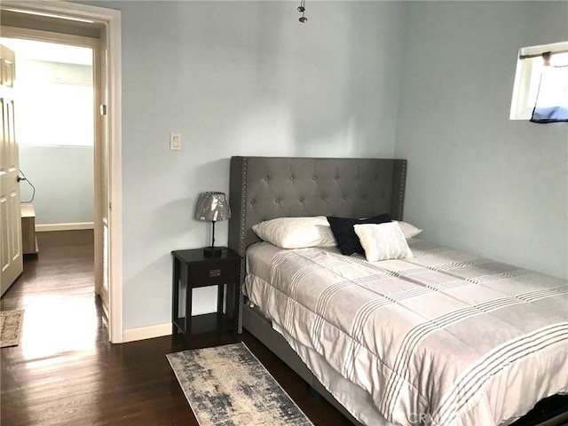 bedroom featuring dark wood-type flooring