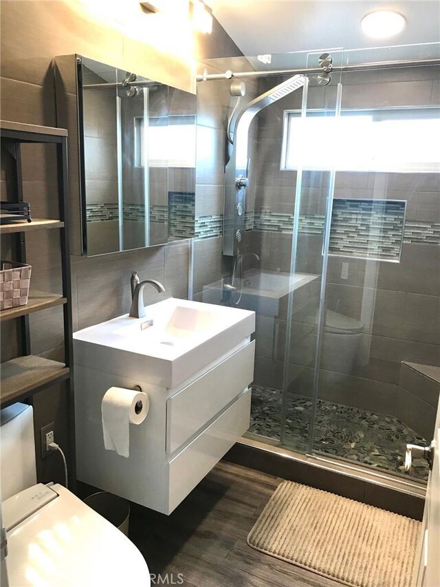 1729 Craigton Ave, Hacienda Heights, CA 91745 - bathroom with a shower stall, wood finished floors, toilet, and vanity