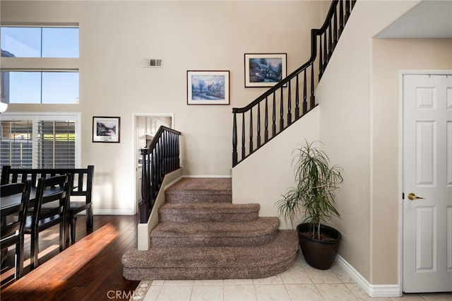 stairway with a towering ceiling