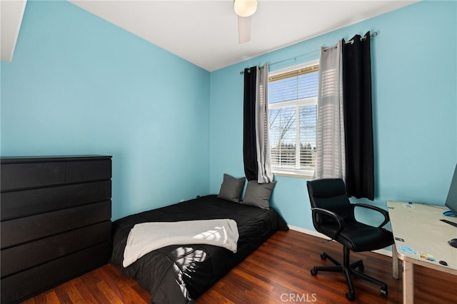 bedroom featuring ceiling fan and dark wood-type flooring