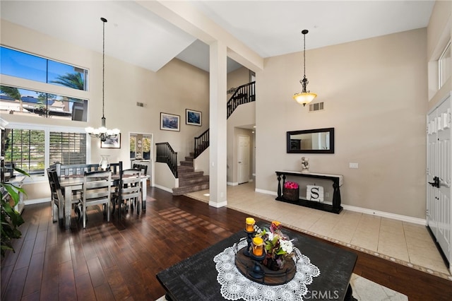 living room with a high ceiling and hardwood / wood-style floors