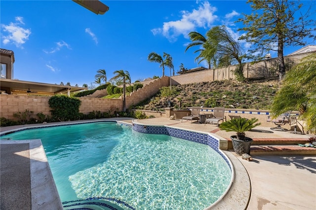 view of pool featuring a patio