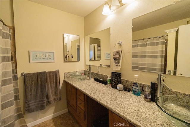 bathroom with tile patterned floors and vanity