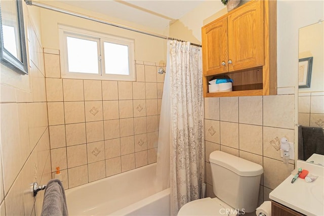 full bathroom featuring shower / bath combo with shower curtain, tile walls, toilet, and vanity