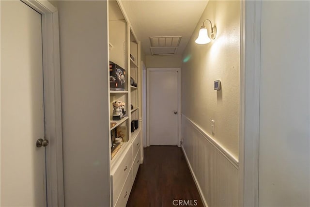 hallway with dark hardwood / wood-style flooring