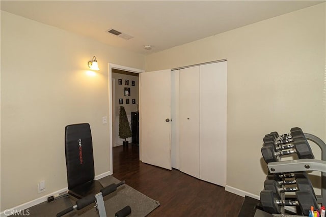 workout room featuring dark hardwood / wood-style floors