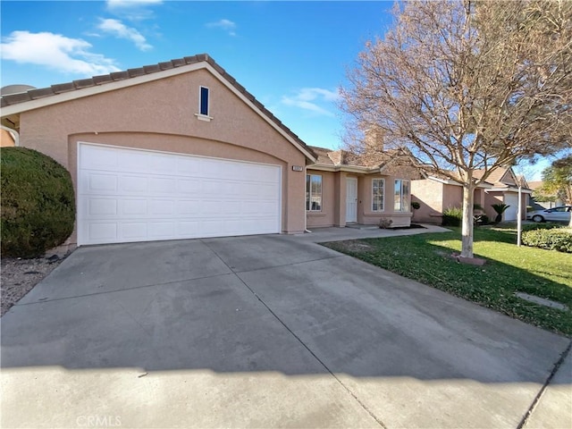 single story home with a front lawn and a garage