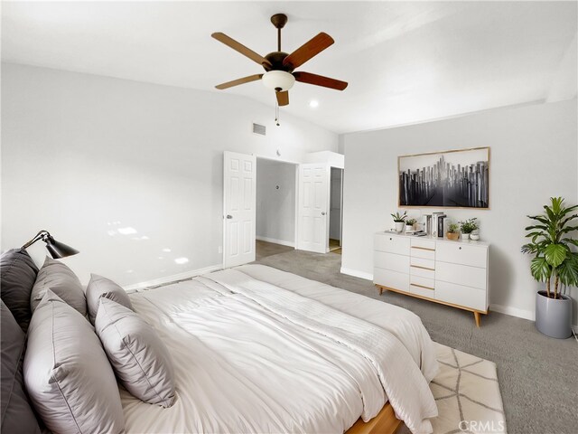 bedroom with vaulted ceiling, ceiling fan, and carpet floors