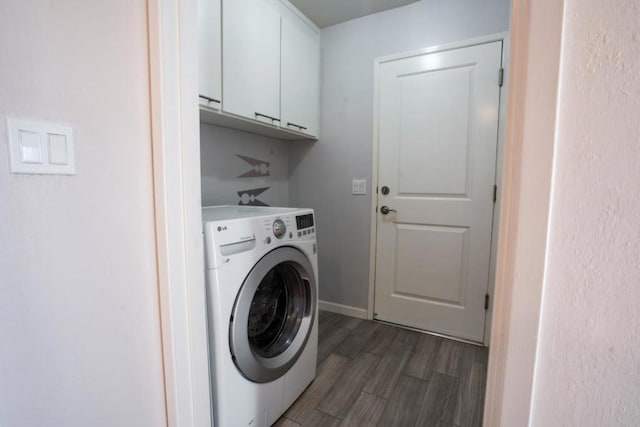 laundry room with cabinets, washer / clothes dryer, and dark hardwood / wood-style floors