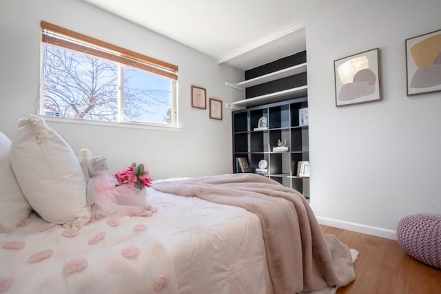 bedroom with wood-type flooring